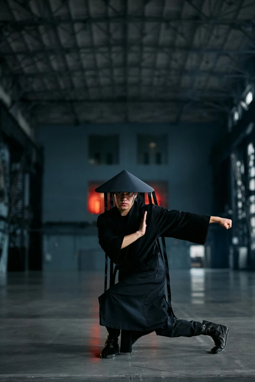 a man in a black robe is doing a trick, inspired by Ma Quan, pexels contest winner, square, full body with costume, avatar image, ready to strike