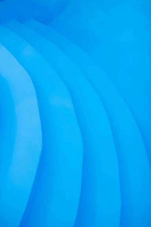 the inside of an inflatable pool with blue water, an abstract sculpture, by Doug Ohlson, unsplash, plasticien, low detail, spines, solid colours, light blue