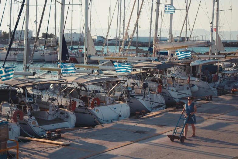 a bunch of boats that are sitting in the water, greek style, profile image, ignant, standing on the mast