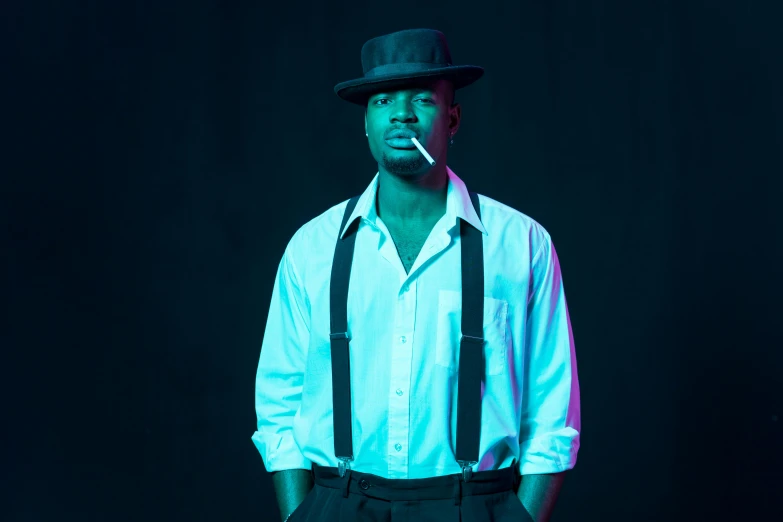 a man in a hat with a cigarette in his mouth, an album cover, inspired by Theo Constanté, unsplash, harlem renaissance, moody blue lighting, wearing black dress and hat, ( ( dark skin ) ), a handsome