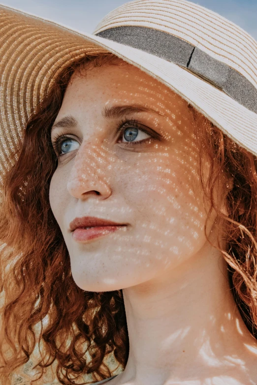 a close up of a woman wearing a hat, trending on pexels, renaissance, sun dappled, drawn with dots, redhead woman, fair complexion