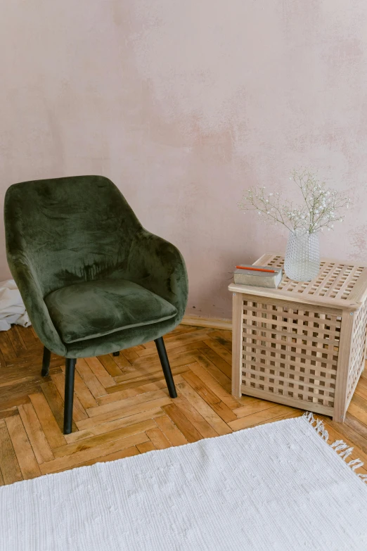 a green chair sitting on top of a wooden floor, inspired by Constantin Hansen, pexels contest winner, velvet tablecloth, cozy environment, warsaw, gif