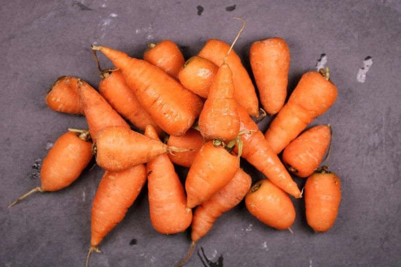 a pile of carrots sitting on top of a table, 2 1 0 mm, thumbnail, listing image, uncropped