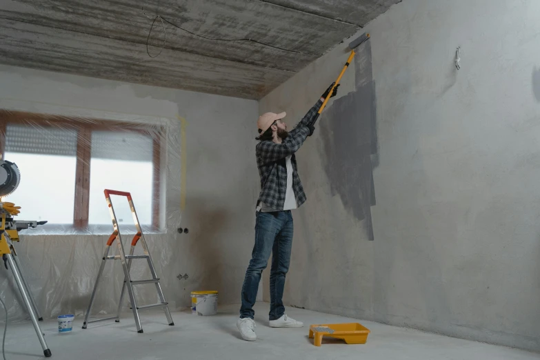 a man that is standing in the corner of a room, painting on the ceiling, grey backdrop, 15081959 21121991 01012000 4k, thumbnail