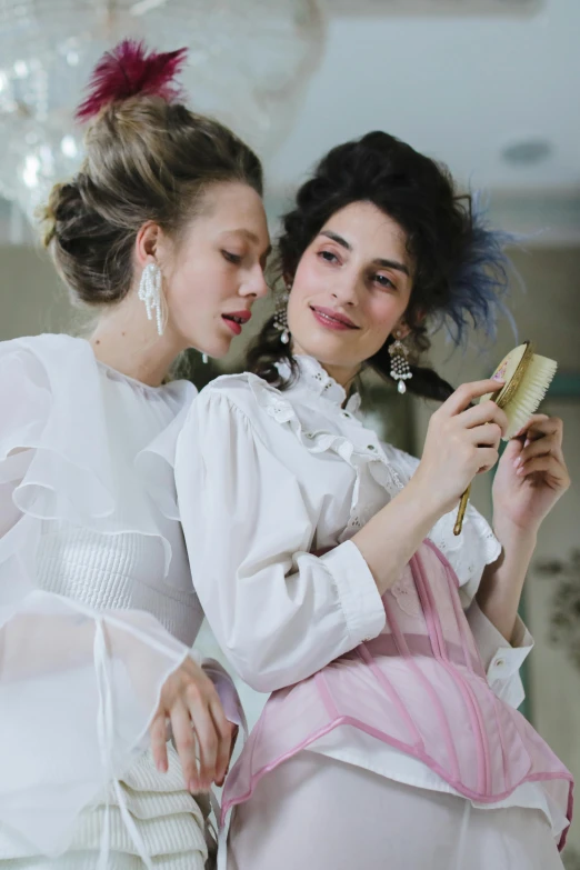 a couple of women standing next to each other, rococo, zoomed in, white clothing, celebrating, hair