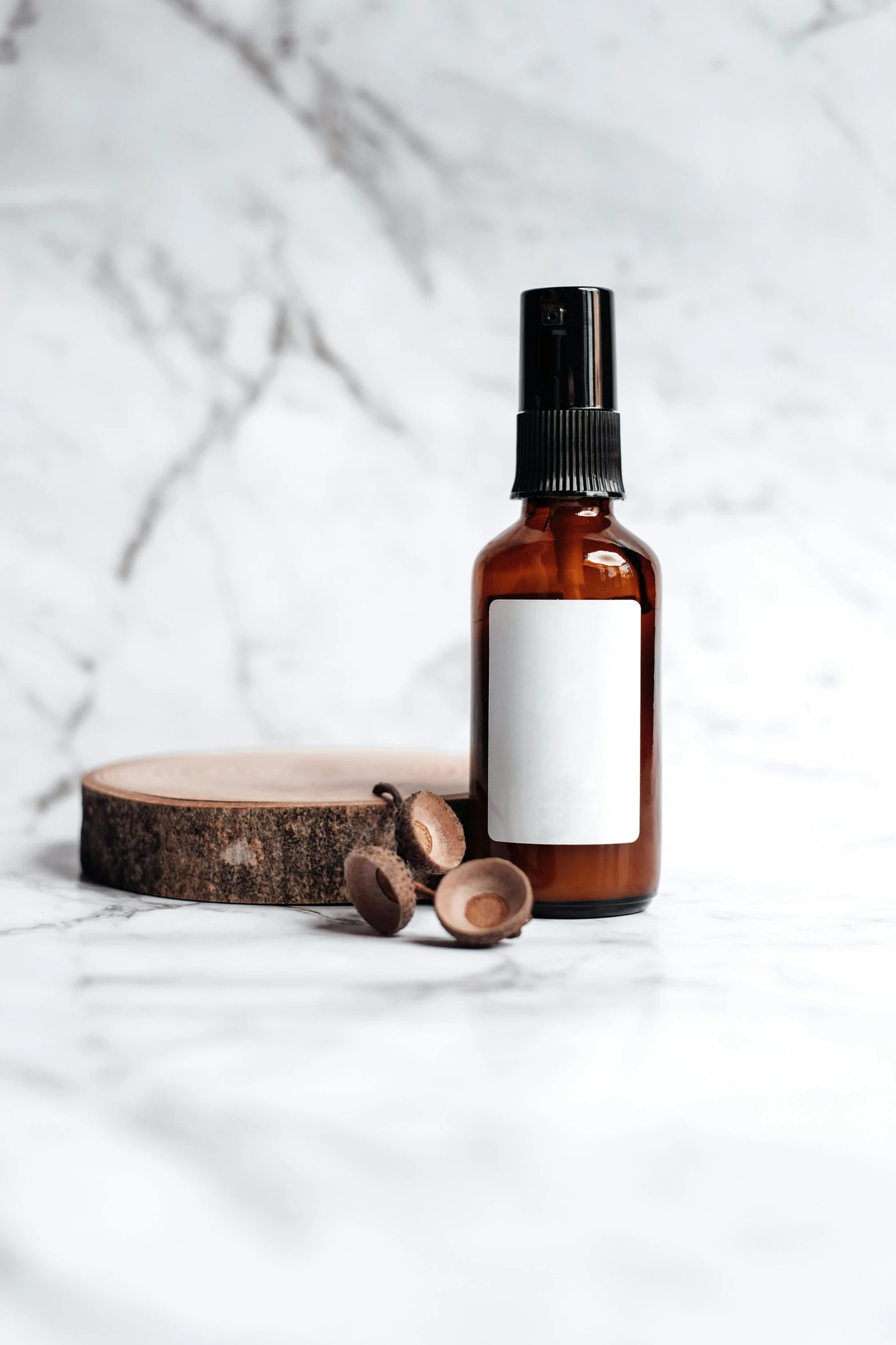 a bottle of essential oil on a marble surface, a picture, by Andries Stock, trending on pexels, wood print, brown, blank, round format