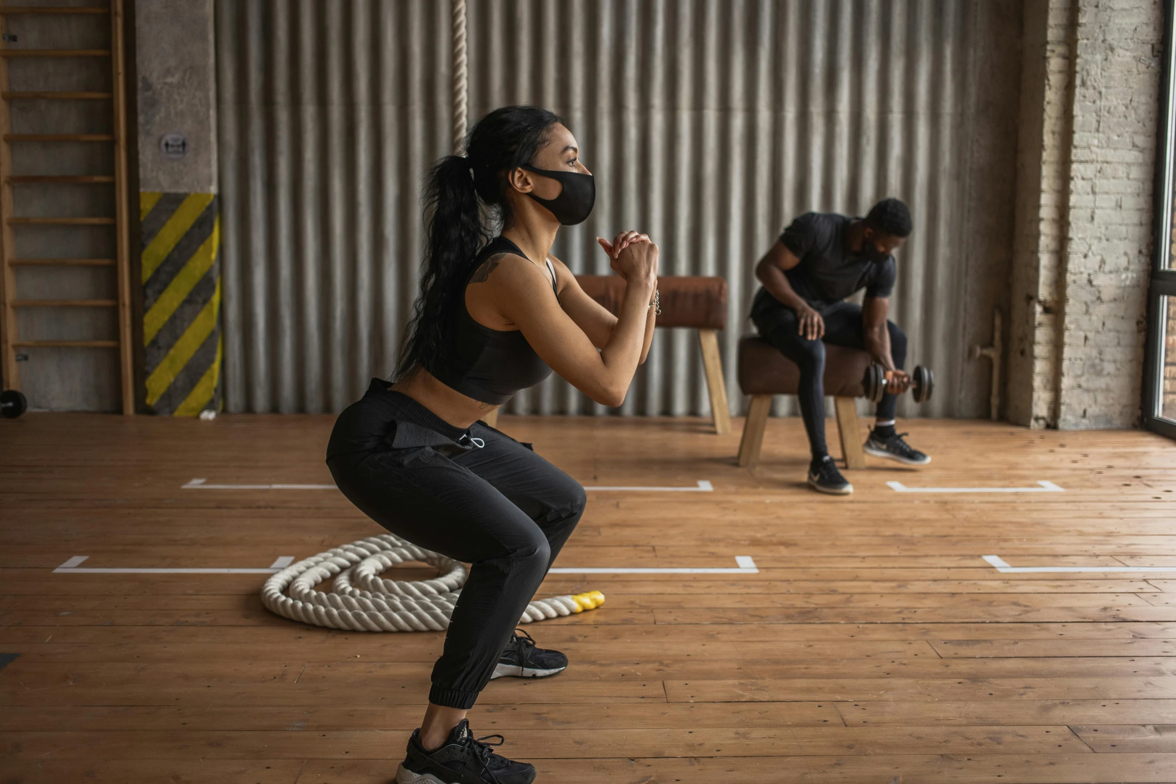 a woman squatting on a rope in a gym, pexels contest winner, renaissance, people are wearing masks, sydney park, avatar image