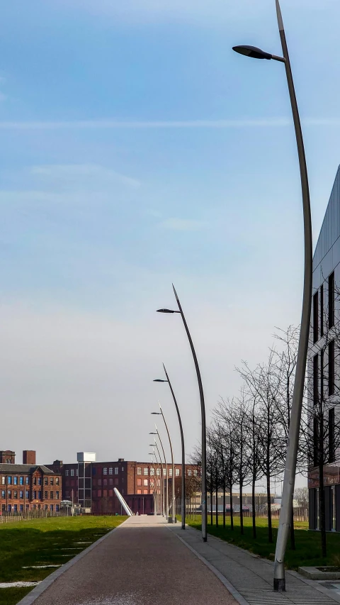 a red fire hydrant sitting on the side of a road, by Jacob Toorenvliet, conceptual art, very long spires, coventry city centre, panorama shot, steel archways