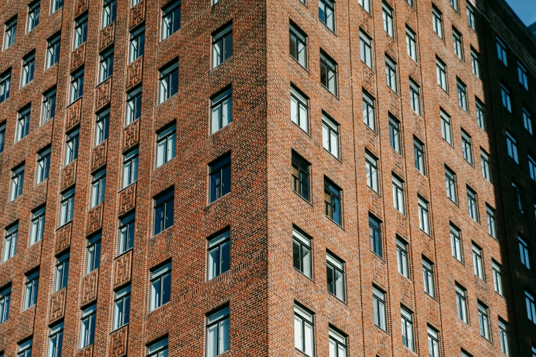 a tall brick building with lots of windows, by Tobias Stimmer, unsplash, square shapes, usa-sep 20, ten flats, low detail