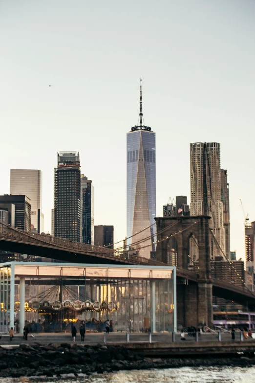 a bridge over a body of water with a city in the background, trending on unsplash, modernism, world trade center twin towers, slide show, full frame image, frank gehry