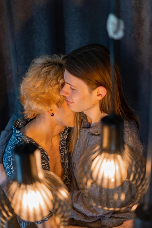 a couple of women standing next to each other, inspired by Nan Goldin, pexels contest winner, renaissance, kissing together cutely, lights inside, hygge, full frame image