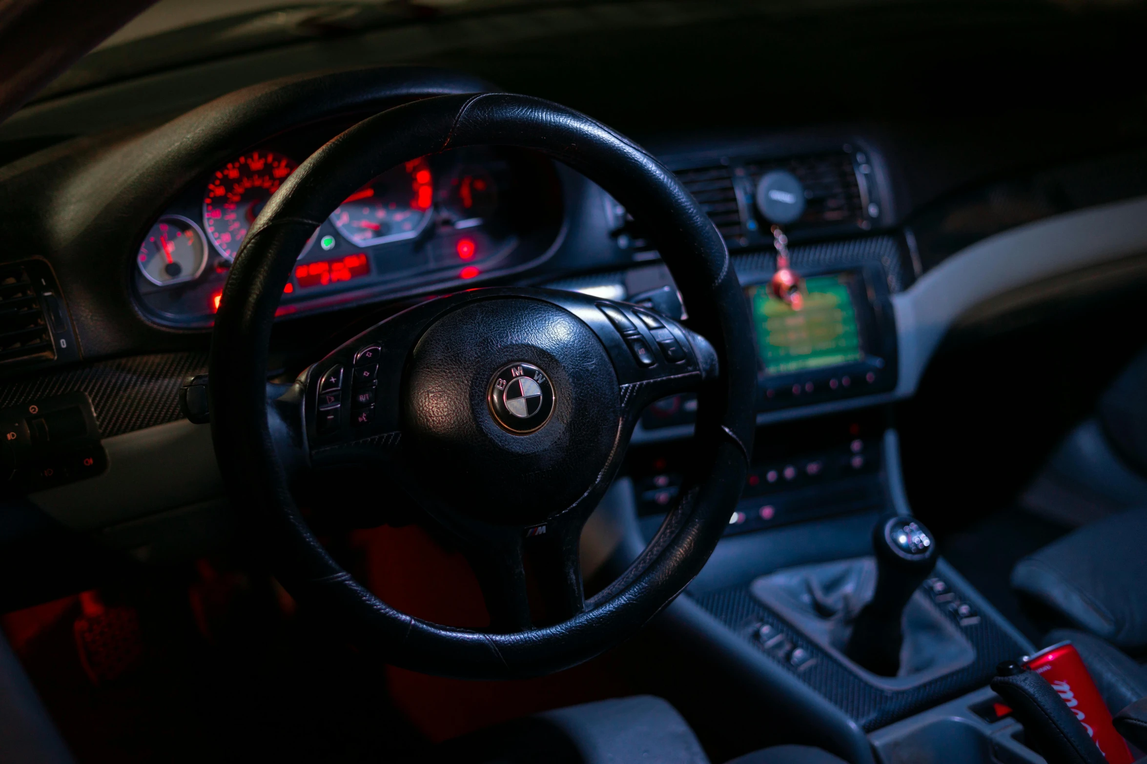 a close up of a steering wheel in a car, a portrait, inspired by Elsa Bleda, unsplash, renaissance, bmw m 1, low lighting, 90s photo, y2k”