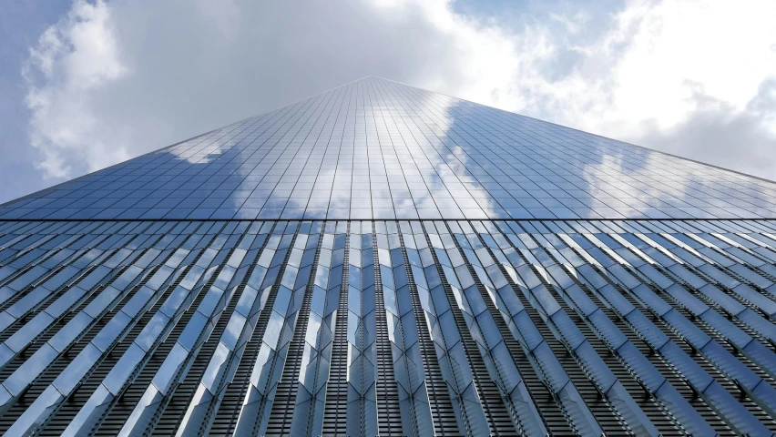 a very tall building with a lot of windows, pexels contest winner, 9 / 1 1 attacks, fan favorite, shiny silver, ground - level view