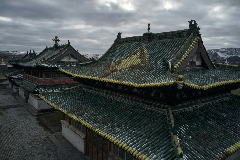 the roof of a building on a cloudy day, a detailed matte painting, inspired by Wang Yi, unsplash contest winner, cloisonnism, mongolia, green, square, old town
