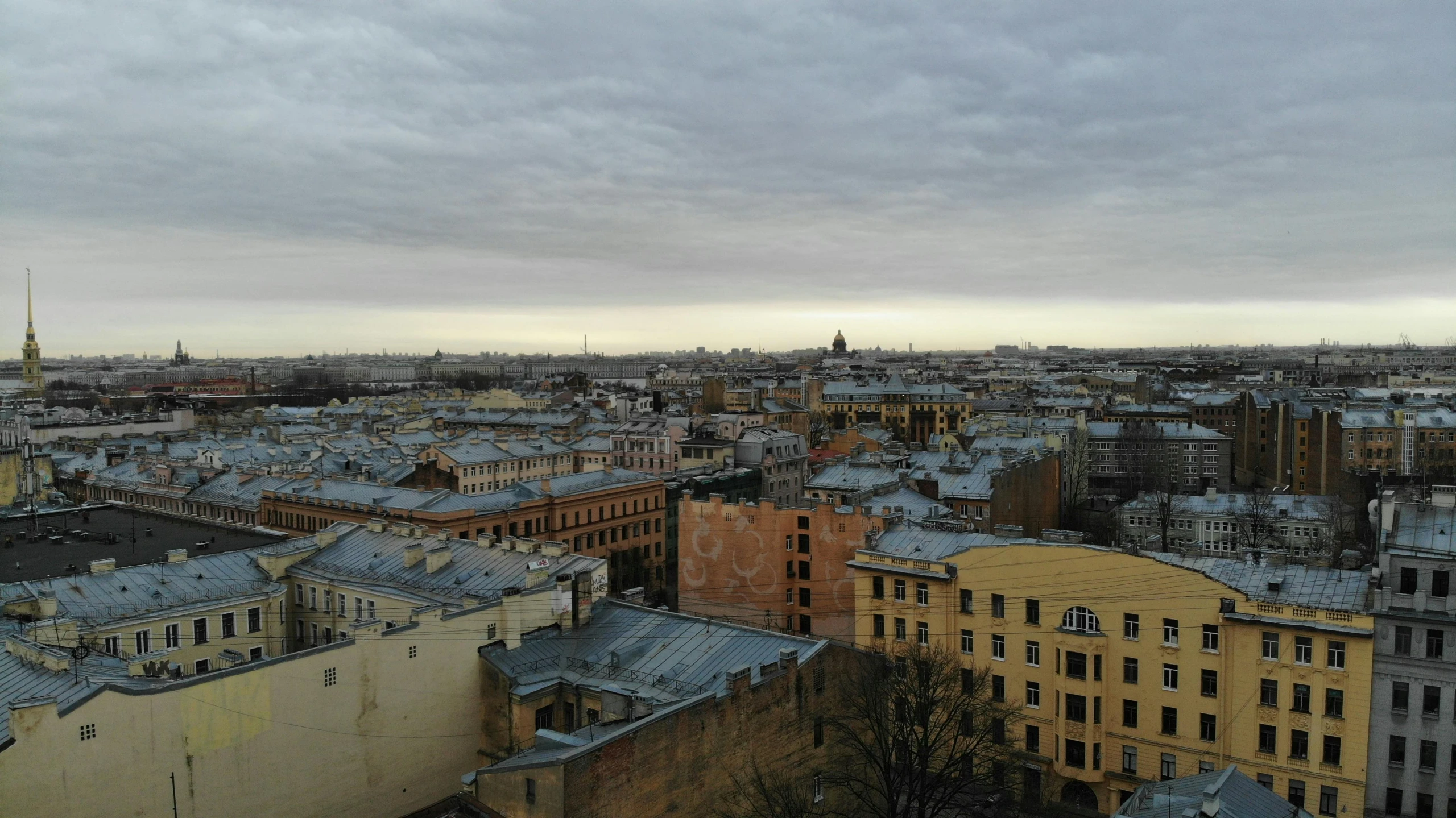 a view of a city from the top of a building, by Alexander Runciman, pexels contest winner, socialist realism, saint petersburg, overcast gray skies, panorama view of the sky, фото девушка курит