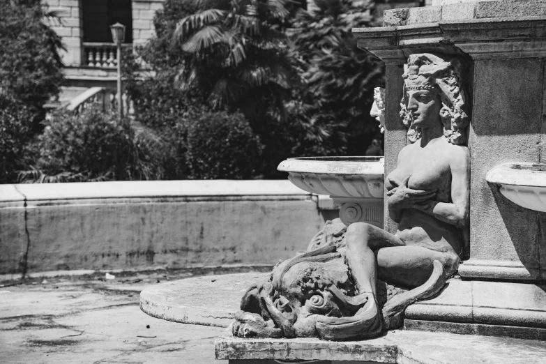 a black and white photo of a fountain, a statue, renaissance, hearst castle, taken in the early 1960s, resting, 35mm —w 1920 —h 1080