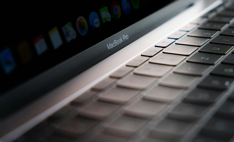 a close up of a laptop computer keyboard, a computer rendering, by Robbie Trevino, pexels, 2 5 6 x 2 5 6 pixels, ap press photo, apple, led