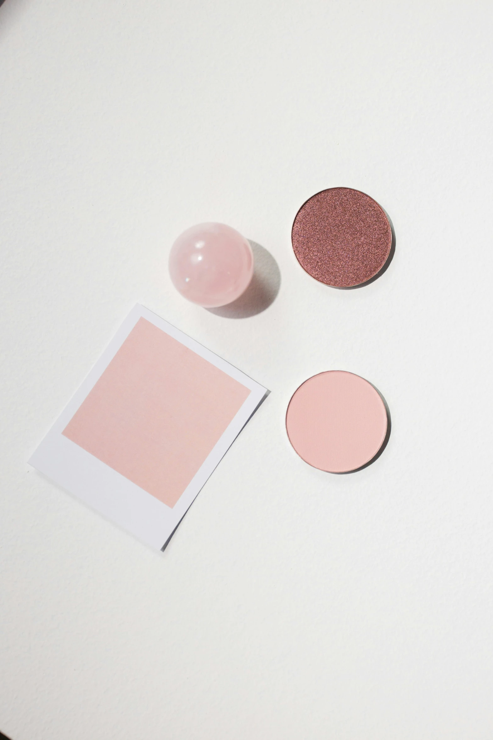 a laptop computer sitting on top of a white table, pastel makeup, round shapes, pale red, textured base ; product photos