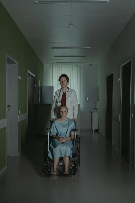 a woman in a wheelchair and a man in a lab coat, by Attila Meszlenyi, cinematic luts, ( ( theatrical ) ), hospital lighting, promo image