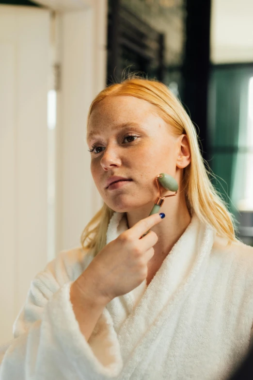 a woman brushing her teeth in front of a mirror, inspired by Louisa Matthíasdóttir, reddit, gemstone forehead, loputyn and matcha, profile image, silicone skin