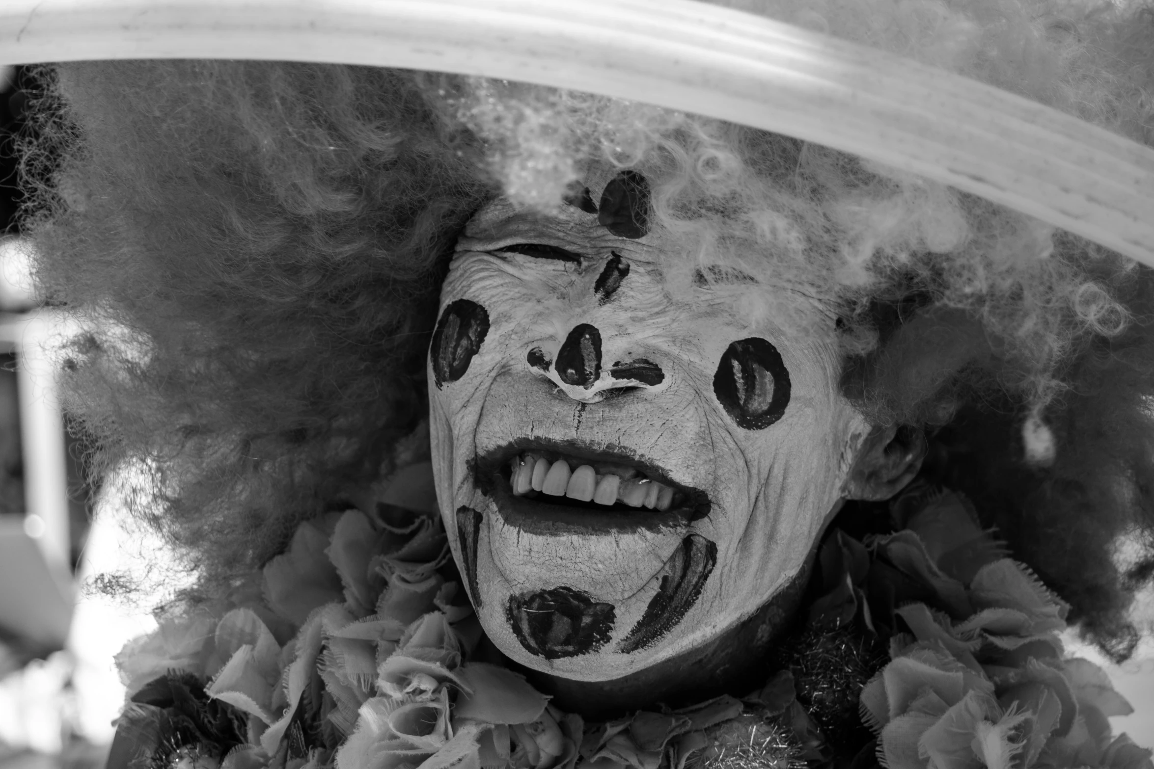 a black and white photo of a clown, by Jan Rustem, carnaval de barranquilla, highly detailed photo of happy, circle pit demons, jordan peele's face