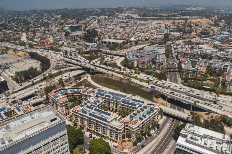 an aerial view of a city with lots of buildings, a digital rendering, unsplash, renaissance, city bay bridge aqueduct, solar, the city of santa barbara, grain”