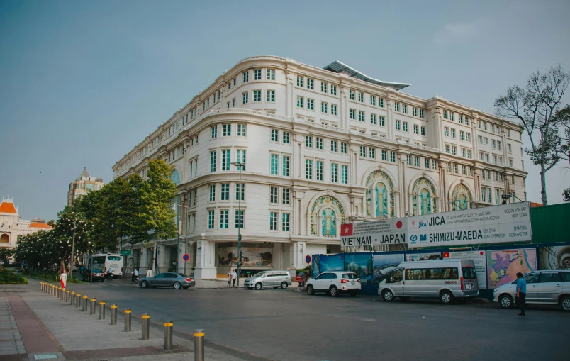 a large white building sitting on the side of a road, by Sam Dillemans, pexels contest winner, art nouveau, dang my linh, square, phuoc quan, high quality upload