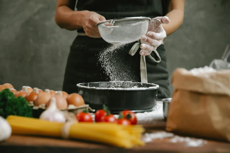 a woman is sprinkling flour into a bowl, pexels contest winner, pots and pans, avatar image, professional image, frying nails