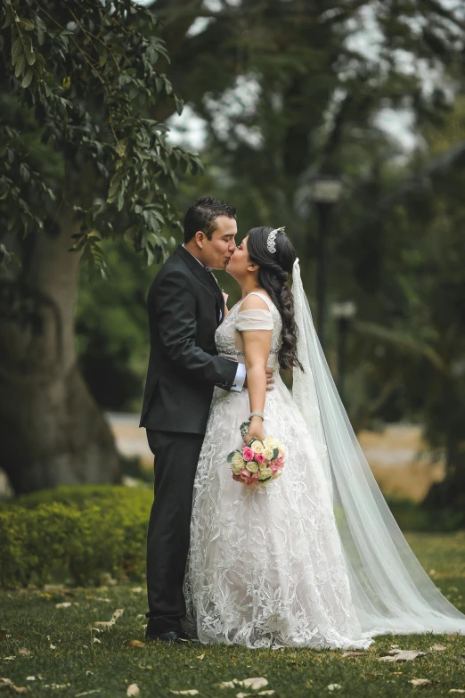 a bride and groom kissing in a park, by Randy Gallegos, peru, square, high-quality photo, bouquet