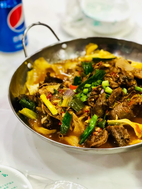 a close up of a pan of food on a table, 王琛, square, very vibrant, horned