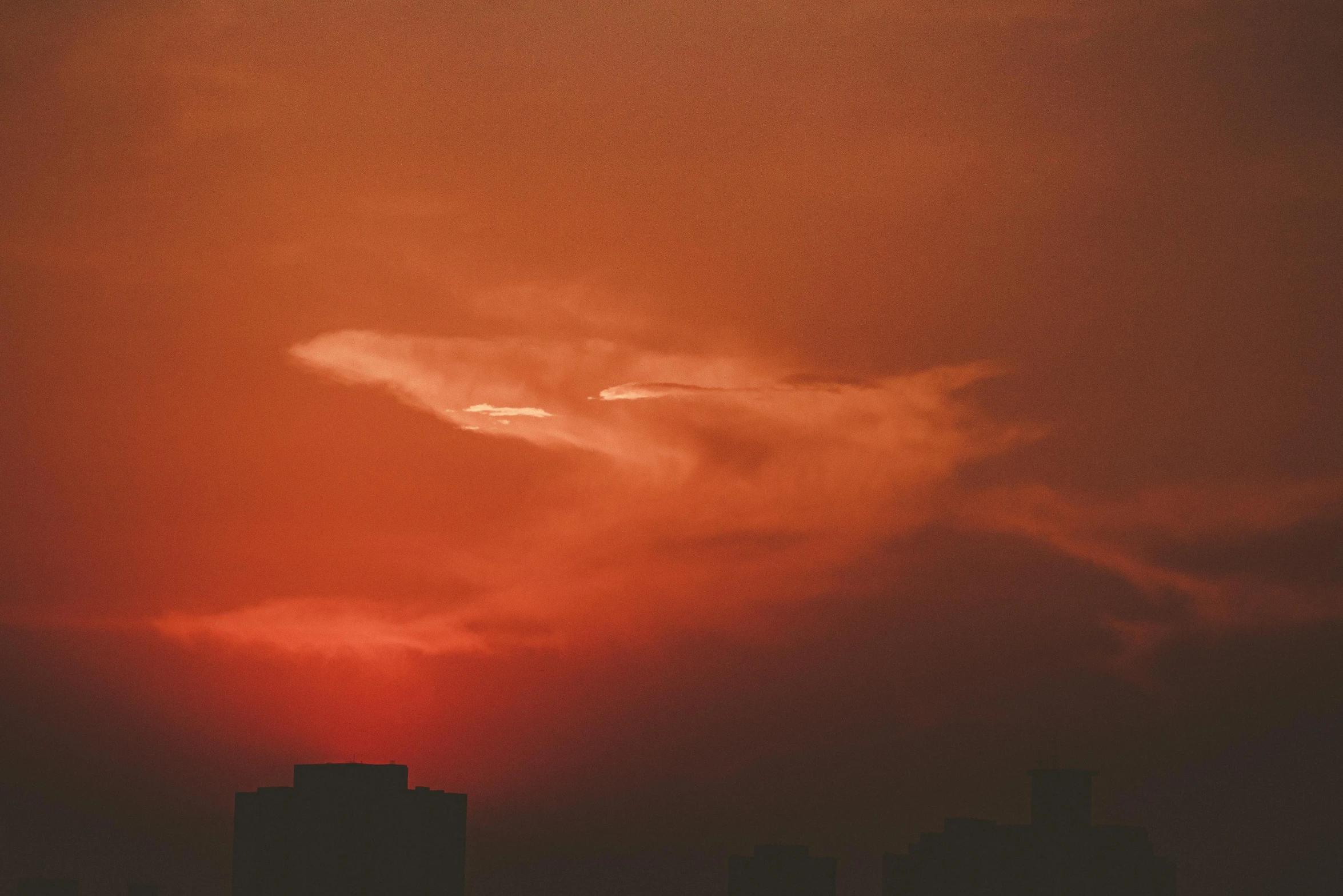 the sun is setting over the city skyline, inspired by Elsa Bleda, pexels contest winner, tonalism, red cumulonimbus clouds, alessio albi, orange gradient, red colored