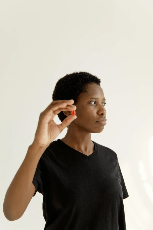 a woman holding a cell phone to her ear, by artist, visual art, bone jewellery, mit technology review, one black, slightly red