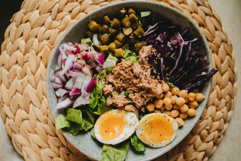 a close up of a bowl of food on a table, by Carey Morris, pexels contest winner, purple, kete butcher, salad, extra pickles and onions