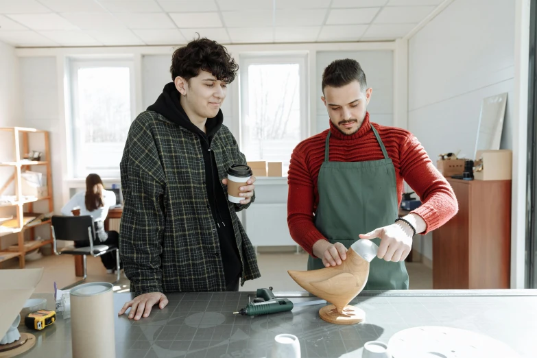 a couple of men standing next to each other in a room, arbeitsrat für kunst, pouring techniques, coffee, thumbnail, school class