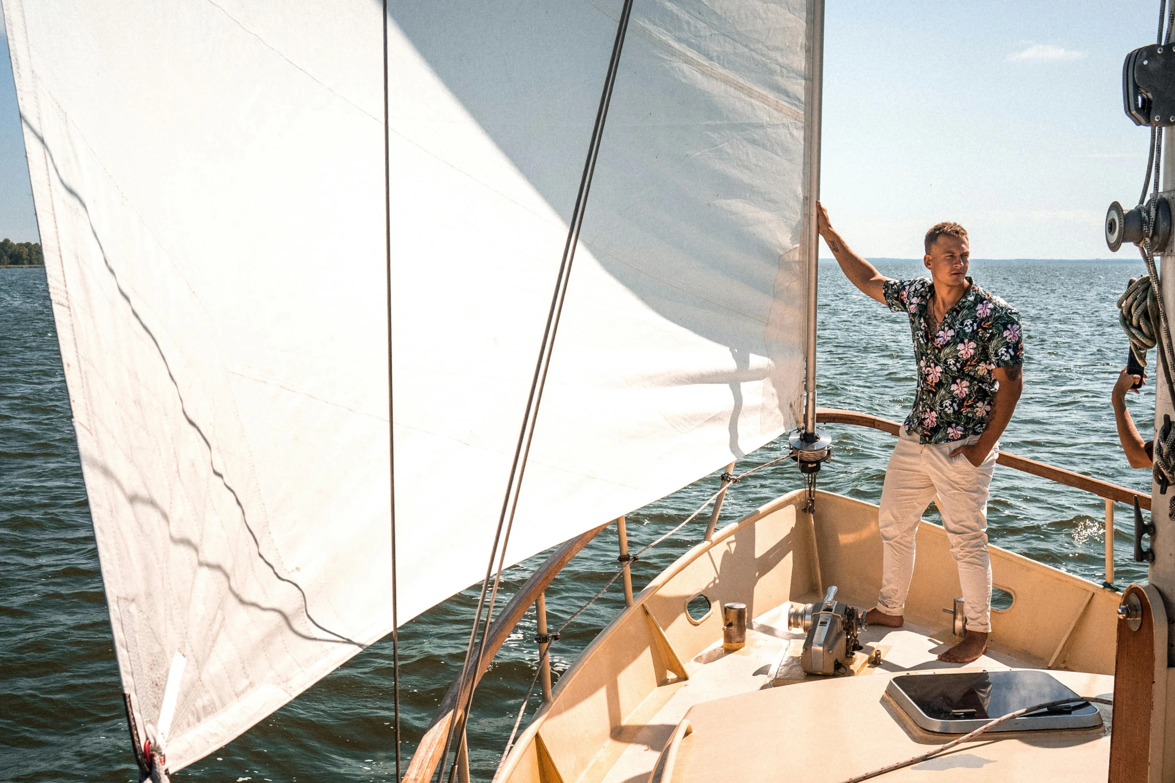 a man standing on the bow of a sailboat, happening, profile image, splento, in the sun, carefully crafted