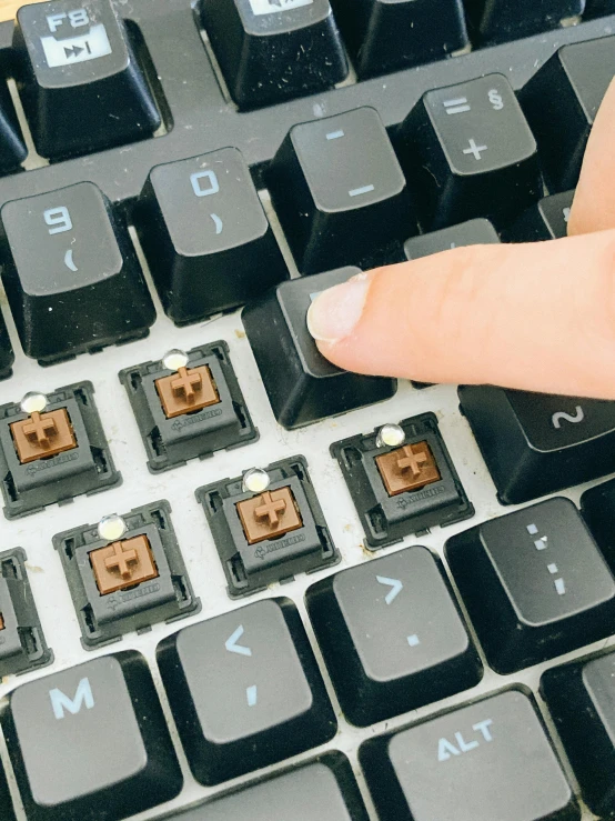 a close up of a person's finger on a keyboard, a digital rendering, by Jason Felix, unsplash, wearing a brown, 2 5 6 x 2 5 6 pixels, switches, reddit meme