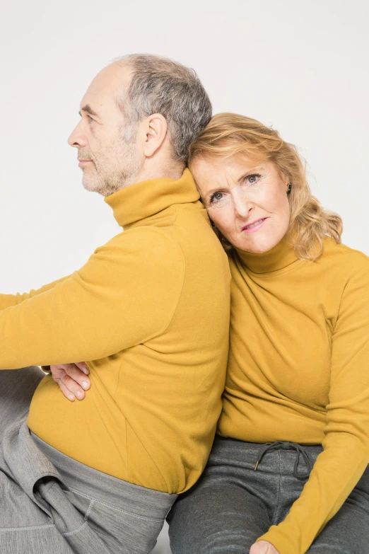 a man and a woman sitting on a couch, by Matija Jama, trending on reddit, tight around neck, 5 5 yo, studio shoot, half turned around