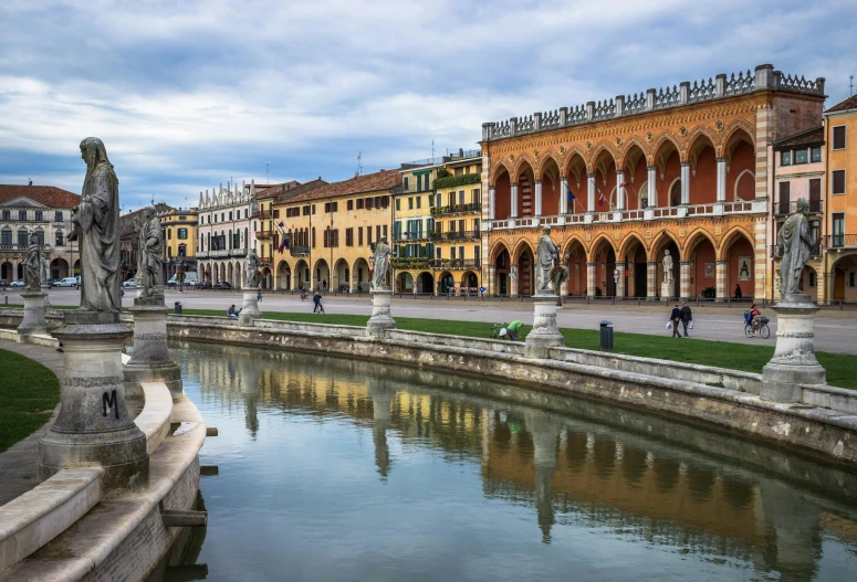 a large body of water next to a bunch of buildings, inspired by Gaetano Sabatini, pexels contest winner, renaissance, fountains and arches, square, gotic harts, pininfarina