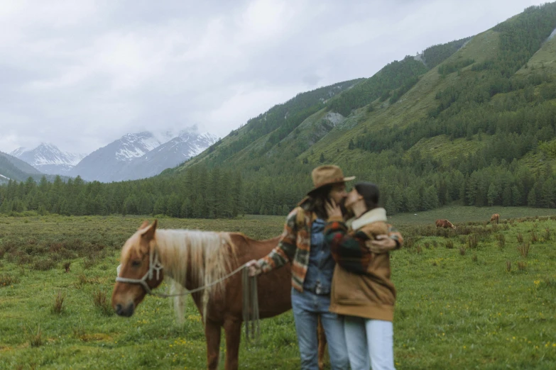 two people standing next to a horse in a field, pexels contest winner, mountain scape. film still, kissing each other, sichuan, avatar image