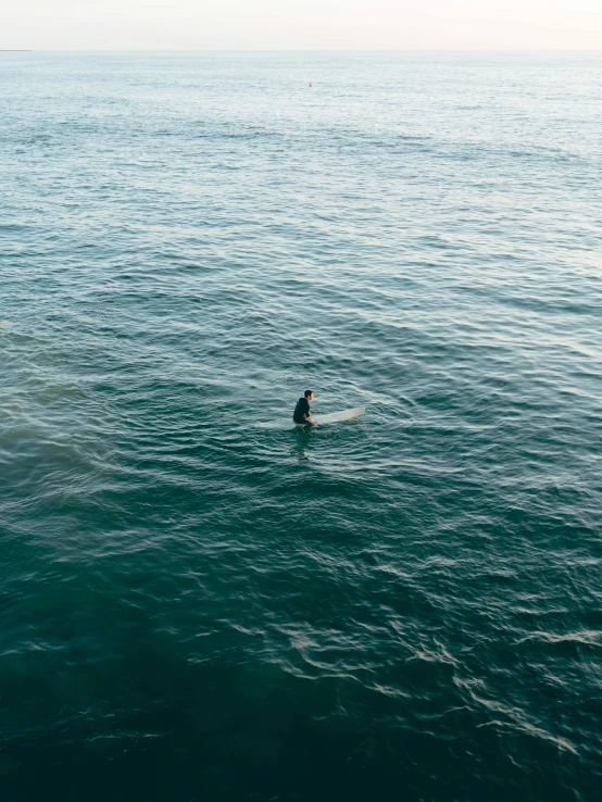 a man riding a surfboard on top of a body of water, a picture, by Elsa Bleda, full frame image, high quality image, rectangle, single figure