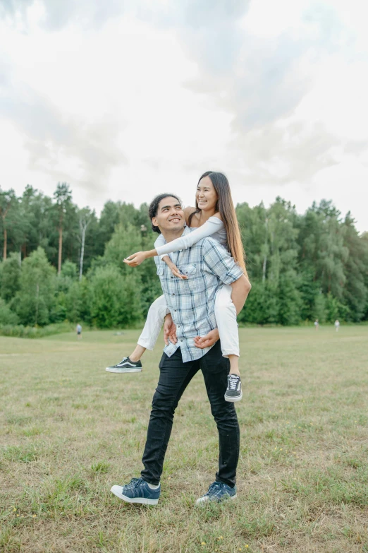 a man carrying a woman on his back in a field, pexels contest winner, wearing casual clothing, russian girlfriend, asian male, 15081959 21121991 01012000 4k