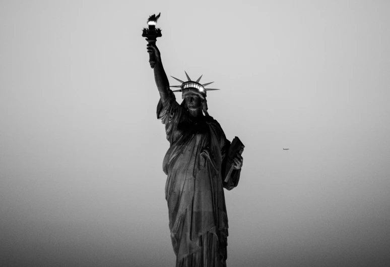 a black and white photo of the statue of liberty, a statue, by Matija Jama, pexels contest winner, american realism, made of bronze, 2019, a wide full shot, independence