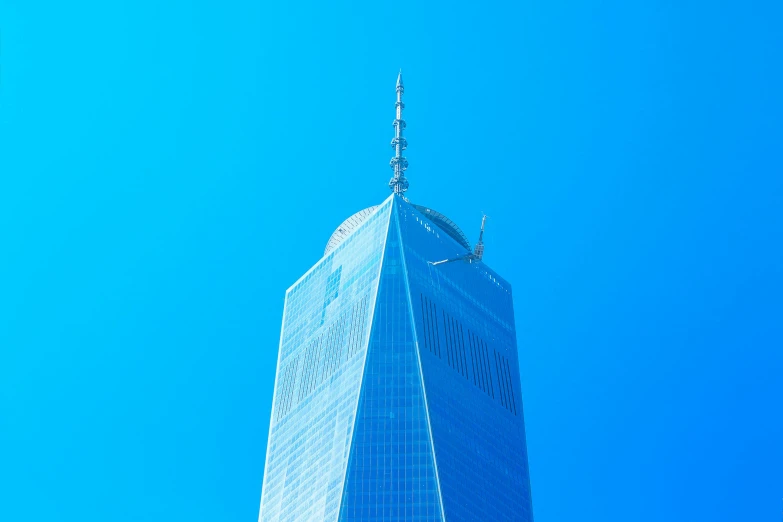 a very tall building with a very blue sky in the background, pexels contest winner, 9 / 1 1 attacks, fan favorite, blue walls, spangled