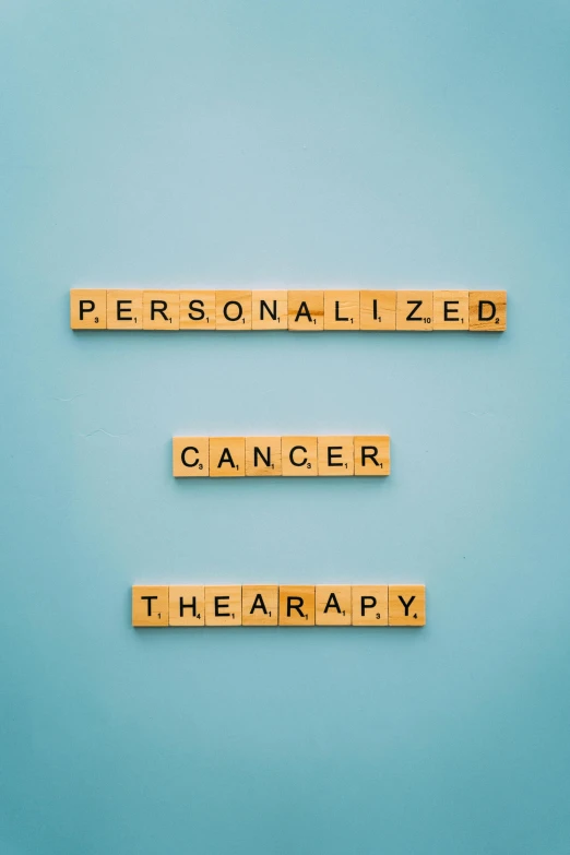 scrabbles spelling personalized cancer therapy, a colorized photo, pexels, 3 - piece, persona, 2263539546], may)
