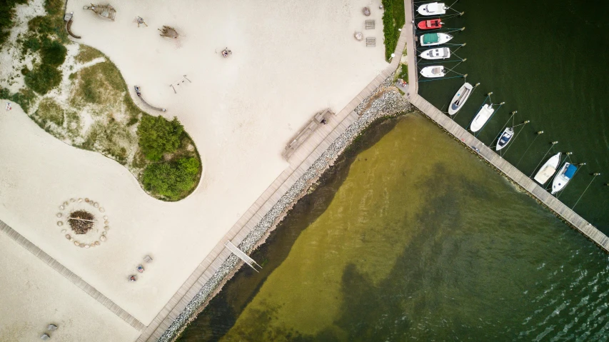 a group of boats sitting on top of a body of water, by Sebastian Spreng, pexels contest winner, algae, white beaches, a park, flat lay