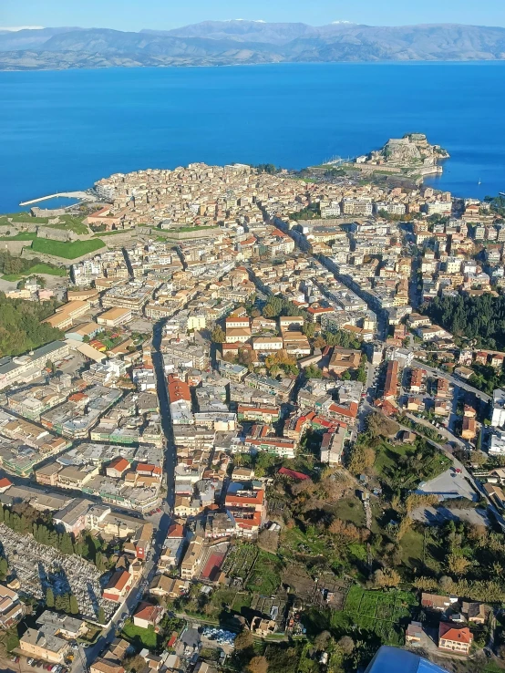 an aerial view of a city next to the ocean, sienna, slide show, conversano, super detailed image