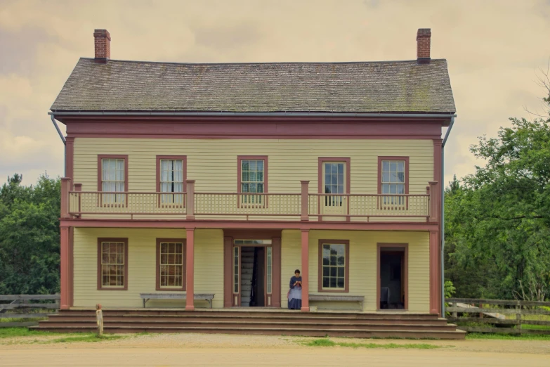 a couple of people that are standing in front of a house, by Alison Geissler, pexels contest winner, preserved historical, prairie, storefront, square