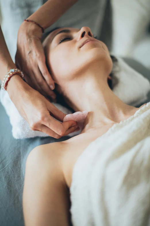 a woman getting a facial massage at a spa, a portrait, inspired by Elsa Bleda, unsplash, renaissance, collar around neck, square, soft blur, small breasts