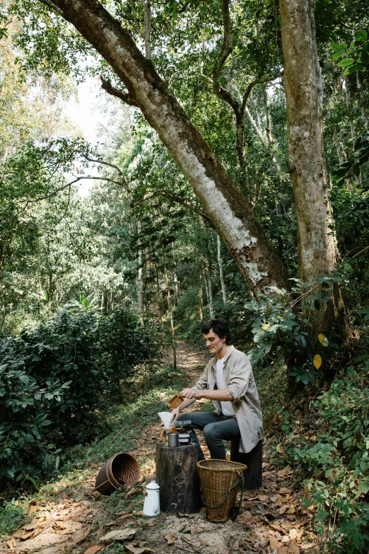 a woman sitting on a bench in the woods, riding a motorbike, jungle clearing, ben mauro, coffee