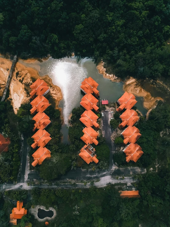 a group of houses sitting on top of a lush green hillside, by Sebastian Spreng, pexels contest winner, stands in a pool of water, orange color tone, game top down view, gif